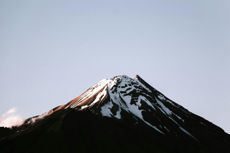 Scenic view of snow-capped Mount Taranaki in Egmont National Park, New Zealand.